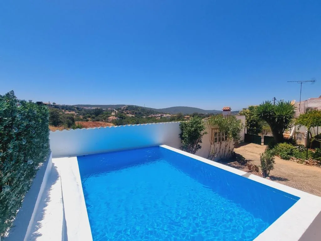 Outdoor swimming pool with countryside views